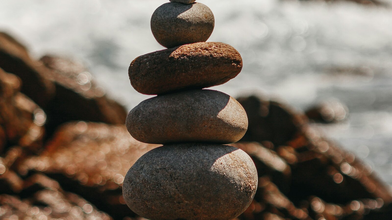 Smooth stones resting beside still water